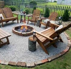 a fire pit surrounded by wooden chairs and tables