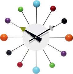 a clock with different colored balls on it's face and the hands are pointing upward