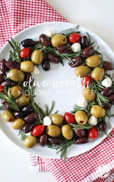 olive wreath on a white plate with red checkered table cloth