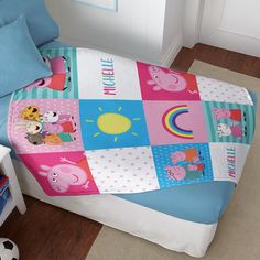 a child's bed with peppa pig comforter and matching pillowcases