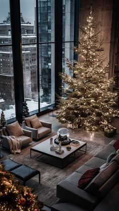 a living room filled with furniture and a christmas tree