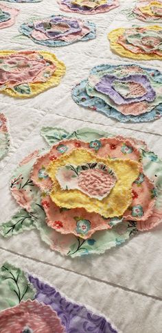 a quilted table cloth with colorful flowers on it