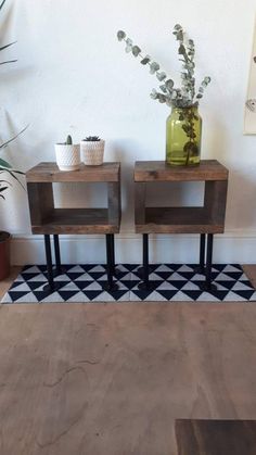 two small wooden tables sitting next to each other on top of a hard wood floor