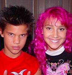 two children with pink hair posing for the camera