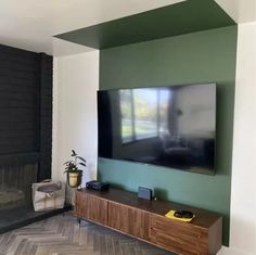 a flat screen tv mounted to the side of a wall