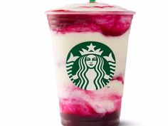 a starbucks drink with red and white liquid