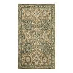 a rug with an ornate design on the front and back side, in green tones