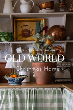 an old world christmas home with green and white checkered table cloth on the counter