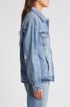 Tap into the oversized trend with this roomy denim jacket featuring eye-catching distressing for rugged character. Front button closure Spread collar Chest button-flap patch pockets Unlined 100% cotton Machine wash, tumble dry Imported Oversized Distressed Denim Jacket For Fall, Oversized Denim Blue Jacket With Frayed Hem, Oversized Denim Jacket With Frayed Hem For Streetwear, Oversized Ripped Light Wash Outerwear, Oversized Ripped Denim Jacket, Oversized Medium Wash Ripped Outerwear, Oversized Distressed Denim Jacket In Medium Wash, Oversized Light Wash Ripped Denim Jacket, Oversized Washed Denim Outerwear