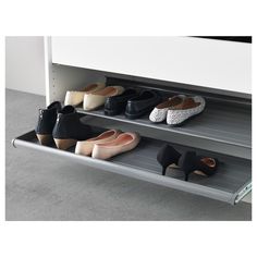 there are several pairs of shoes on the shelf