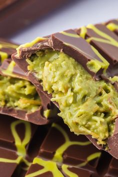 chocolate bar with avocado on top and yellow drizzled around it