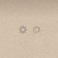 the sun, moon and stars are drawn on paper