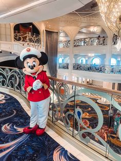 a person dressed as mickey mouse on a cruise ship