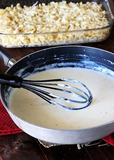 a pan filled with batter sitting on top of a wooden table