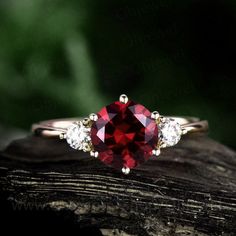 "This is a 1.25 carat garnet engagement ring in solid gold,about 7mm round cut. The accent stones are moissanites,forever classic quality. It can be made in any ring size. However please contact me to custom make it to a special big or small size. It can be made in white gold,rose gold or yellow gold with 14k or 18k. However for some people who are nickel allergic,I can also make it to 925 sterling silver to make you can wear it. The ring is handmade,very high quality! 30 days money back guarant Promise Ruby Ring With Cubic Zirconia, Round Cut Garnet Jewelry For Anniversary, Elegant Round Ruby Promise Ring, Cubic Zirconia Ruby Promise Ring, Elegant Jewelry With Lab-created Ruby For Promise, Elegant Lab-created Ruby Jewelry For Promise, Fine Jewelry Garnet Promise Ring, White Gold Garnet Jewelry For Promise Ring, Fine Jewelry Garnet Promise Jewelry