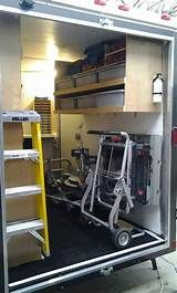 the inside of a fire truck with ladders and other items in its storage area