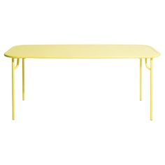 a yellow table with two legs and a long rectangular top on an isolated white background