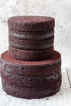 a stack of chocolate cakes sitting on top of each other