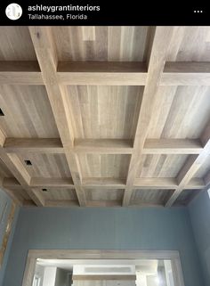 a room with wooden ceiling tiles in it