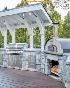 an outdoor bbq with grill built into it