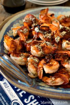 a plate full of cooked shrimp on a table