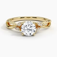 a rose gold engagement ring with three stones