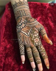 henna tattoo on the palm of someone's hand