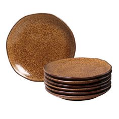 a stack of brown plates sitting on top of each other