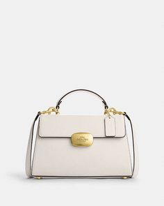 COACH® | Eliza Top Handle Elegant Flap Shoulder Bag For On-the-go, Elegant Satchel With Handle Drop And Flap, Elegant Flap Shoulder Bag With Handle Drop, Elegant Flap Satchel With Detachable Strap, Elegant Flap Satchel For Fall, Elegant Satchel With Detachable Strap For On-the-go, Coach Outlet, Again And Again, Small Accessories