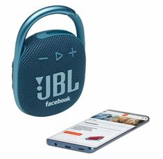 the jbl portable bluetooth speaker is next to a cell phone on a white background