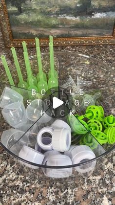 a bowl filled with lots of green plastic items