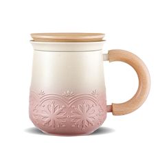 a pink and white ceramic mug with wooden handle