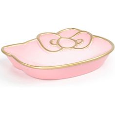 a pink and gold bowl with a bow on the top, sitting in front of a white background