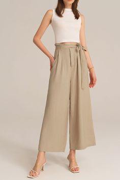 Experience the perfect blend of comfort and style with this casual elastic waist wide leg pants. This pants are designed for versatility and effortless elegance, making them a must-have for any casual occasion. Embrace a relaxed and chic look that is both comfortable and fashion-forward.Material : 75%Viscose+25%LinenElasticity : NoneSku : CL2814S24*Package : 1*PantsCare instructions:Do Not Bleach.Separate dark colors.Iron Low Heat. Chic Spring Wide Leg Pants Solid Color, Solid Color High-waisted Harem Pants For Spring, Spring Solid Color Ankle-length Harem Pants, Casual Solid Ankle-length Harem Pants, High Waist Khaki Wide Leg Pants, Casual Summer Wide-leg Culottes, Non-stretch Beige Ankle-length Wide Leg Pants, Beige Non-stretch Ankle-length Pants, Casual Wide Leg Solid Color Harem Pants