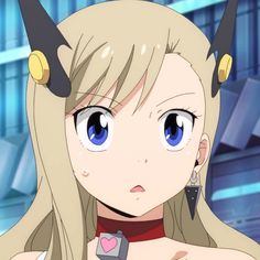 an anime character with horns on her head and big blue eyes looking at the camera