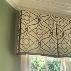 a window curtain with an intricate design on it