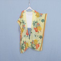 Welcome to my shop, I am in China. It will need around 30 days for international orders. Please consider the time when placing order. Long bohemian kimono,perfect for a casual day out or as a swimsuit cover up. Material: soft polyester fabric,comfortable One size fit all: Width: 35.5 inches (90cm) Side length: 42 inches (107cm) Back length:35.5 inches (90cm) CARE: Wash gently by hand in cold water. Single wash. Don't press! Hang to dry. Maybe you will like other items in my shop, find them here: Printed Kimono Beach Cover-up For Beach Season, Summer Floral Print Wrap Cover-up, V-neck Boho Print Kimono For Beach Cover-up, Hippie Beach Kimono With Kimono Sleeves, Multicolor Summer Kimono For Beach Cover-up, Printed Wrap Kimono For Beach Cover-up, Tropical V-neck Kimono For Summer, Bohemian Floral Print Kaftan For Beach Season, Yellow Summer Beachwear Kaftan