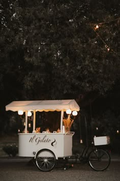 an ice cream cart with lights on it