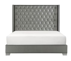 an upholstered bed with white sheets and grey headboard, on a white background