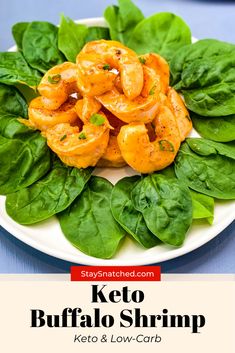 keto buffalo shrimp with spinach leaves on a white plate