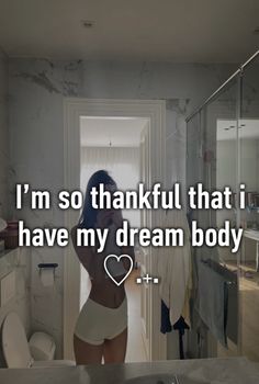 a woman standing in front of a bathroom mirror with the words i'm so thank that i have my dream body