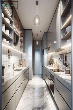 a long narrow kitchen with marble counter tops and stainless steel appliances, along with white walls