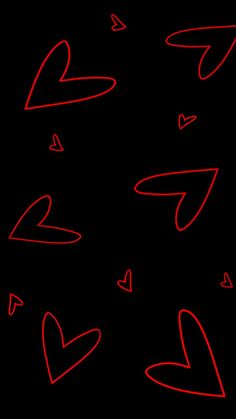 red hearts are drawn on a black background