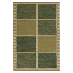 a green and beige rug with squares on the bottom, in different sizes and colors