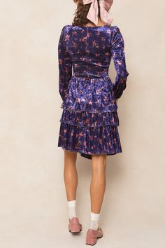 Introducing the Nikki Dress! This stunning knee-length dress features a gorgeous purple velvet fabric with pink florals throughout, giving it a romantic and luxurious feel. The sweetheart neckline and long flowy sleeves add a touch of elegance, while the hidden back zipper and elastic wrist closure make it easy and comfortable to wear. Perfect for any occasion (including the Eras Tour!). Purple Velvet Fabric, Nikki Dress, Velvet Pink, City Woman, Flowy Sleeves, Purple Velvet, Tier Skirt, Eras Tour, Velvet Dress