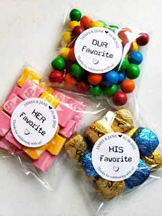 three bags filled with candy on top of a table