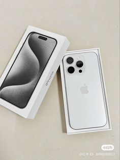 an apple iphone 11 pro in its box next to it's packaging on a table