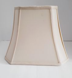 a lamp shade sitting on top of a white table