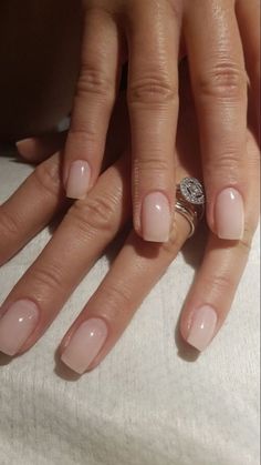 a woman's hand with pink manies and a ring on her finger,