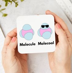 someone holding up a magnet with the word molecquecoli on it